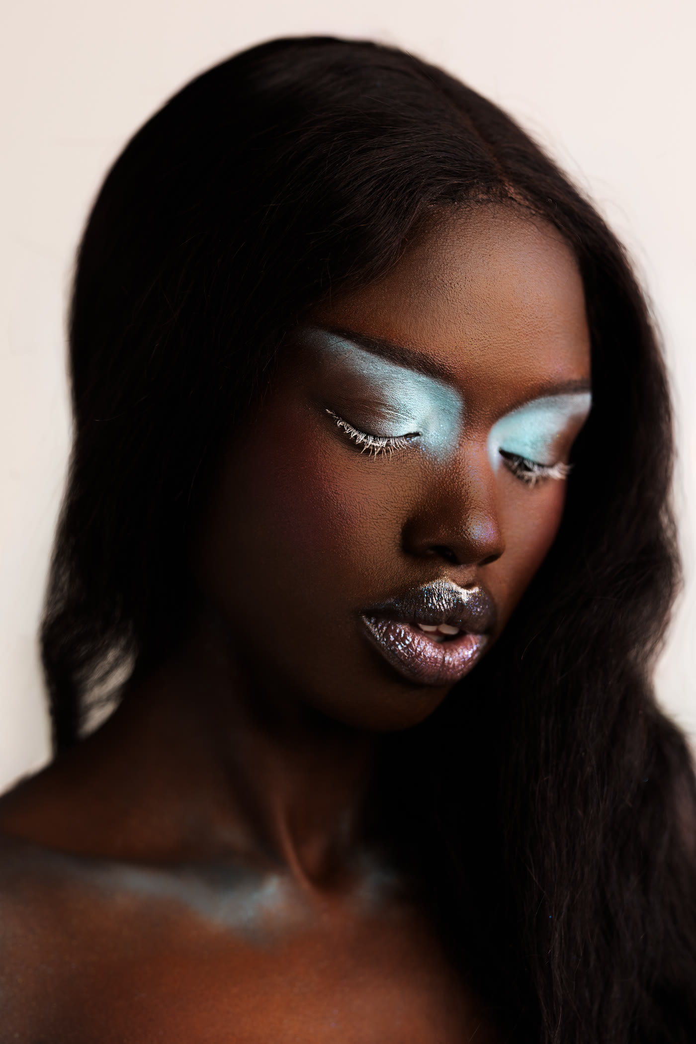 Editorial beauty look with icy blue shadow — makeup by Samantha Kae